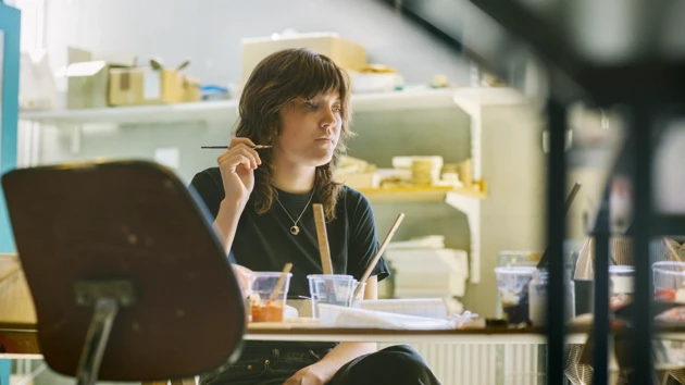Photo of a student painting.